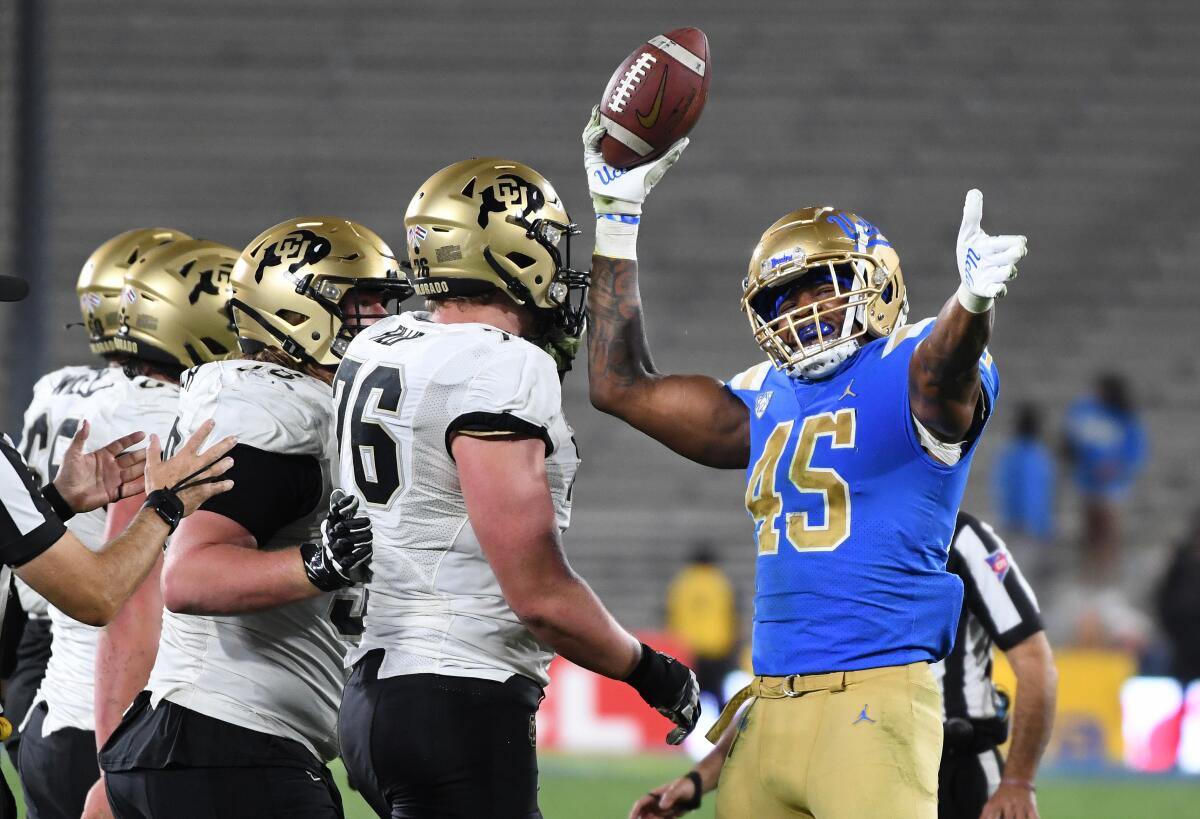 UCLA linebacker Mitchell Agude celebrates is fumble recovery against Colorado in the fourth quarter.