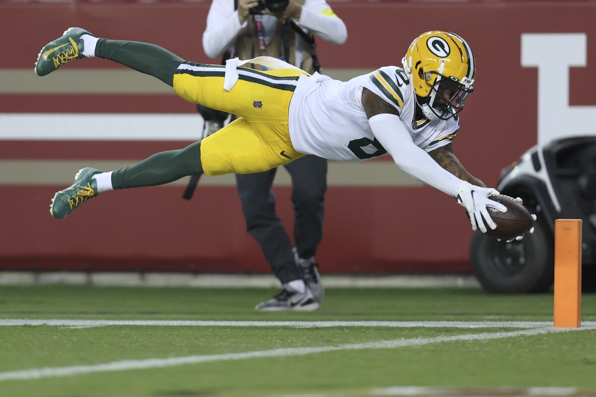 Green Bay Packers wide receiver Amari Rodgers dives for a touchdown during the second half of an NFL preseason football game against the San Francisco 49ers in Santa Clara, Calif., Friday, Aug. 12, 2022. (AP Photo/Jed Jacobsohn)