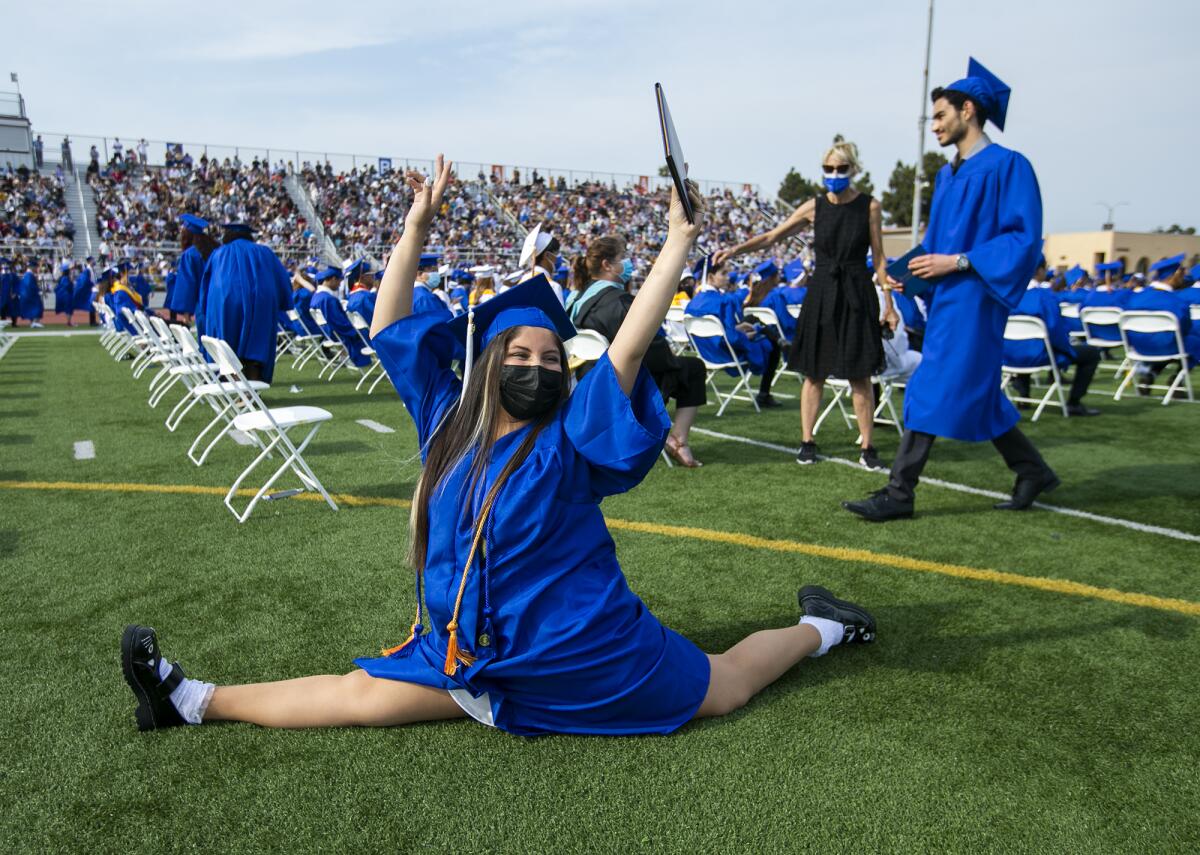 Vivian Espinoza does the splits during the 2021 Fountain Valley High School commencement ceremony.
