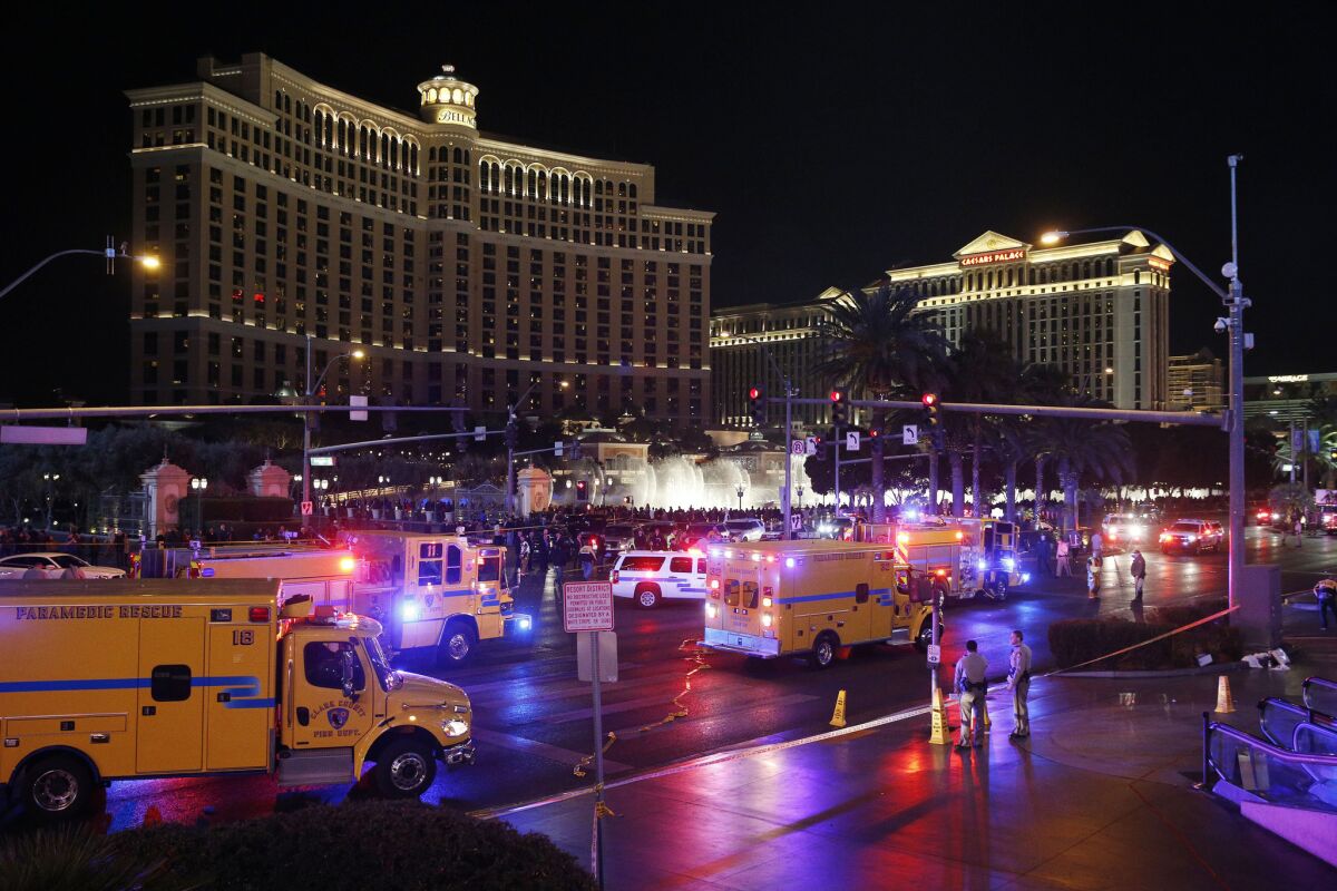 Emergency workers at the scene of a car crash along Las Vegas Boulevard on Sunday.
