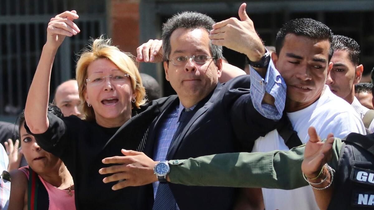 Venezuelan Atty. Gen. Luisa Ortega Diaz, left, was barred from entering her offices in Caracas on Aug. 5, 2017.