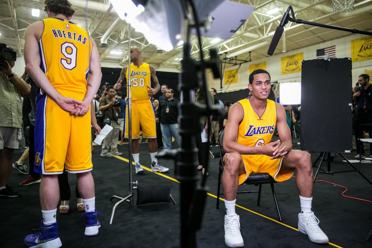 Lakers guard Jordan Clarkson, right, sits down for an interview during the Lakers' media day in El Segundo on Monday.