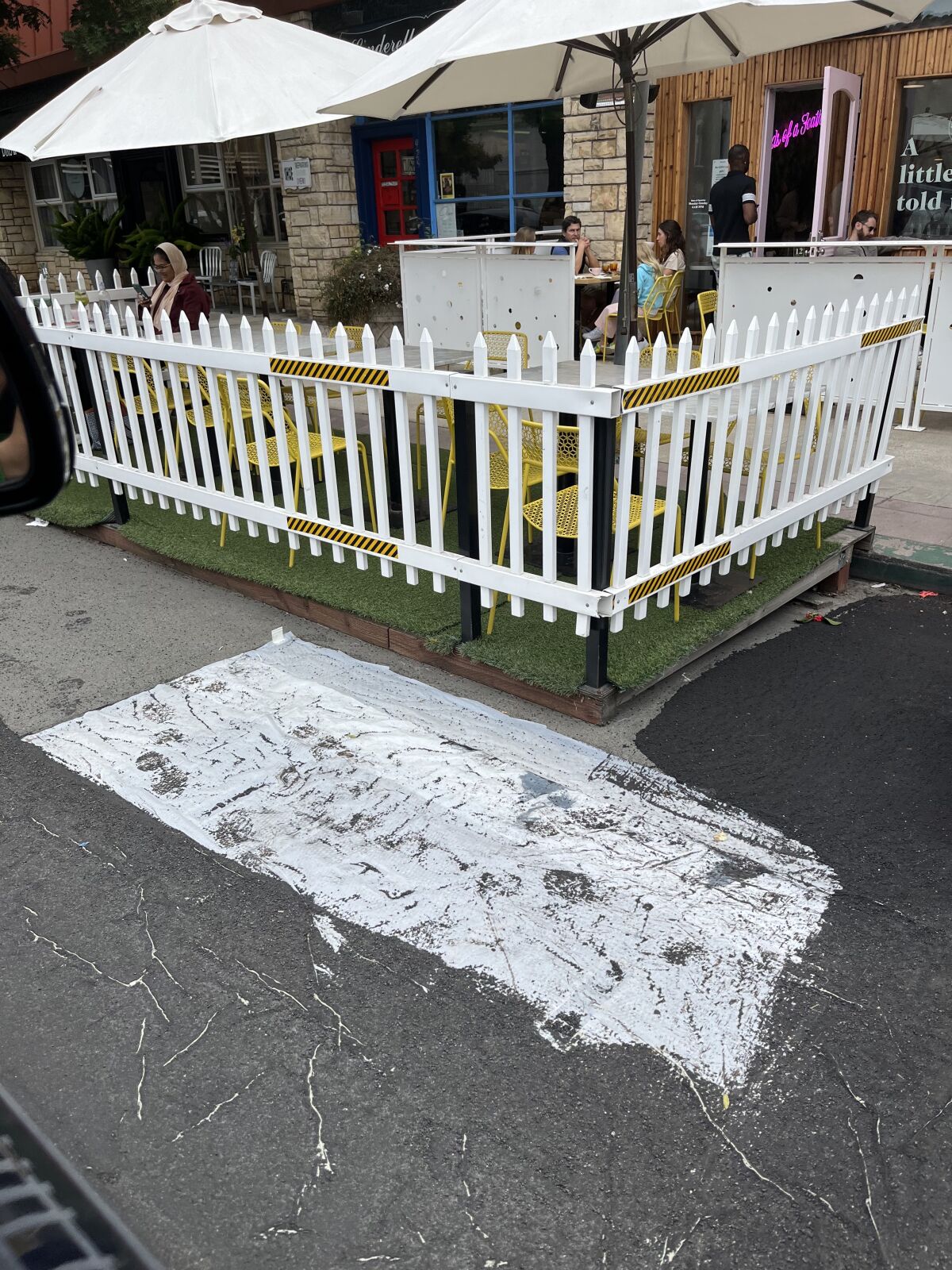 City slurry seal crews appear to have given this outdoor seating area on Silverado Street a wide berth.