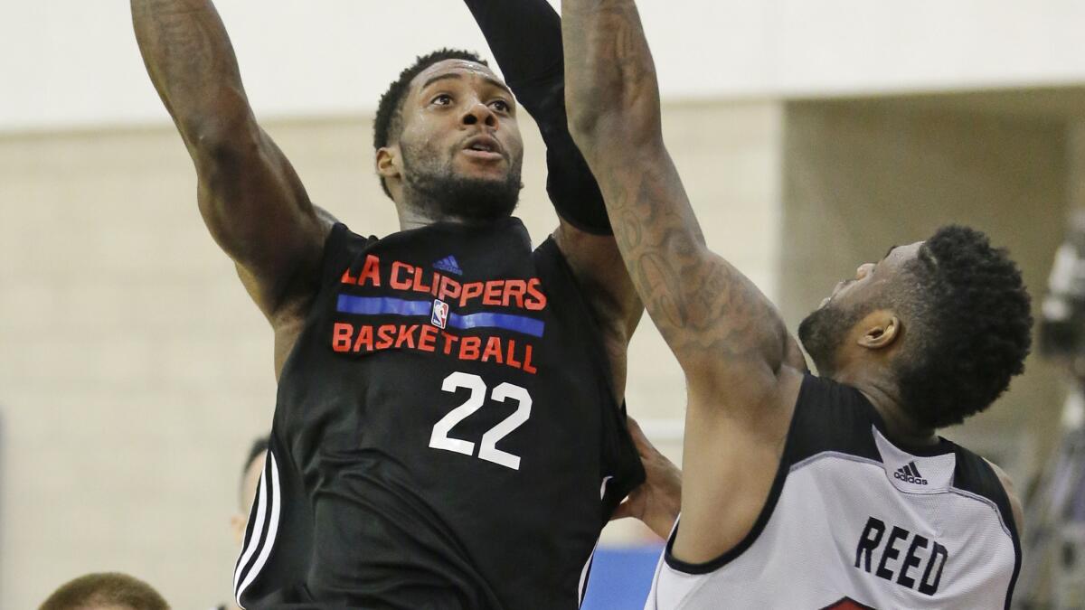 Clippers forward Branden Dawson shoots over Miami Heat center Willie Reed during a summer league game in Orlando, Fla., on July 8.