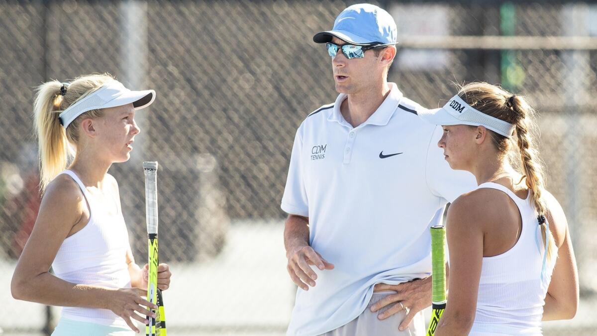 Corona del Mar High coach Jamie Gresh, seen talking with Jane Paulsen, left, and Reece Kenerson during a match against Palos Verdes on Sept. 12, will lead the Sea Kings in the CIF Southern Section Open Division playoffs on Friday.