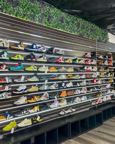 A wall of sneakers on display in a store
