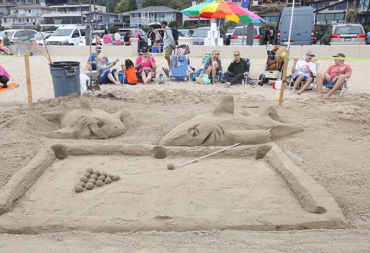 A crowd favorite, "Pool Sharks," carved in the sand.