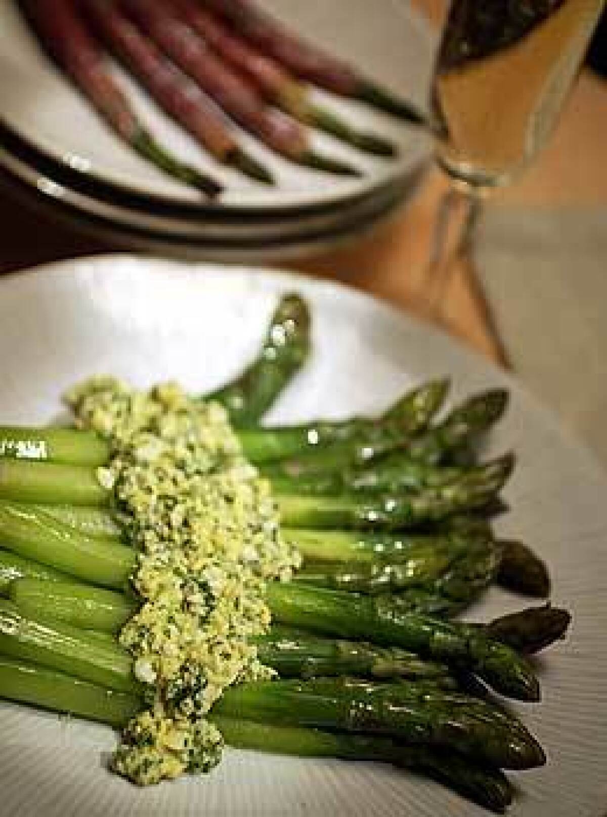 Thick asparagus are best peeled and sauced. Here theyre served with sauce mimosa, a vinaigrette enriched with hard-boiled eggs. In the background, medium spears are wrapped in prosciutto and roasted. Thin spears are best in dishes with other ingredients.