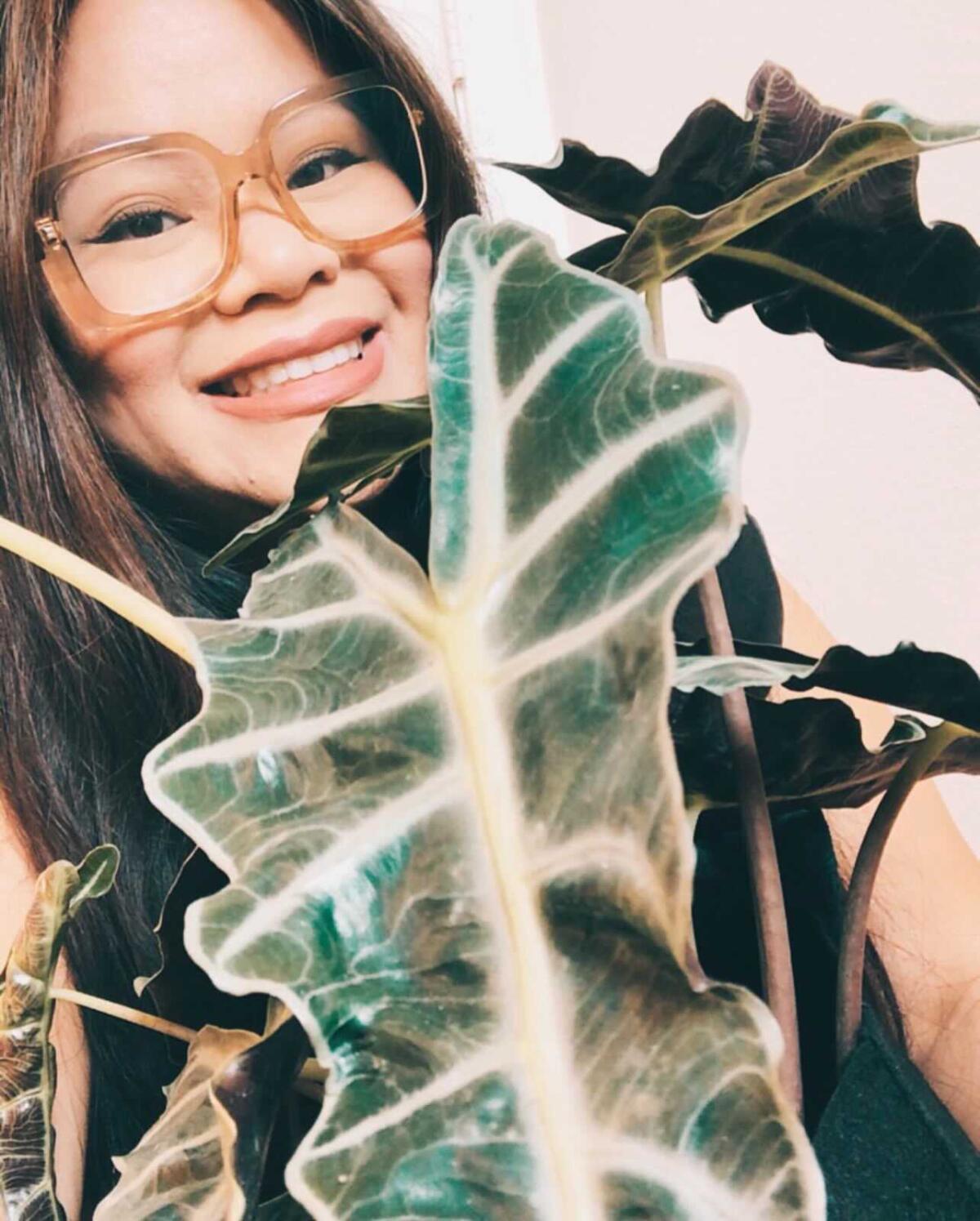 Reader Mary Tacadena with her plant
