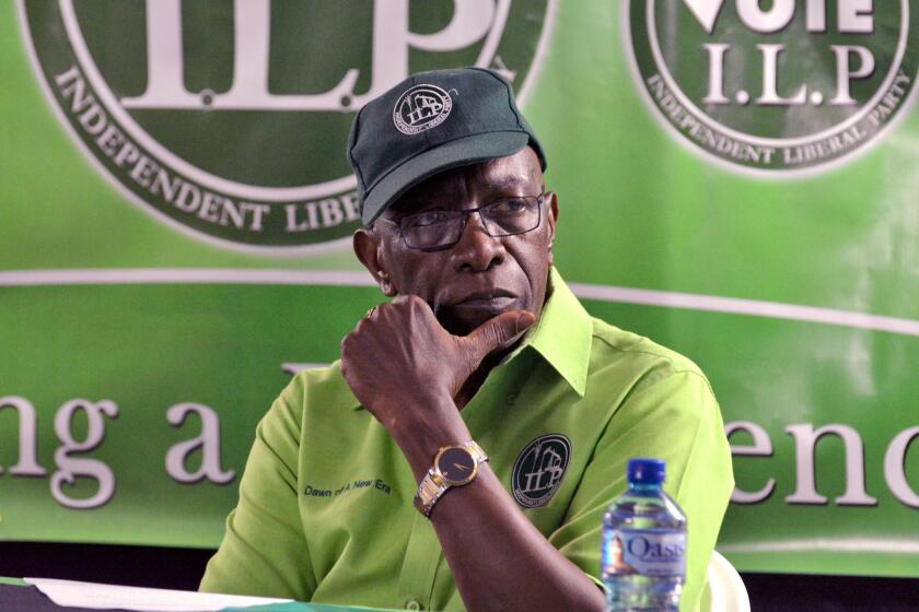 Former FIFA Vice President Jack Warner listens to a speaker during a meeting of his political organization, the Independent Liberal Party, in Trinidad and Tobago in June.