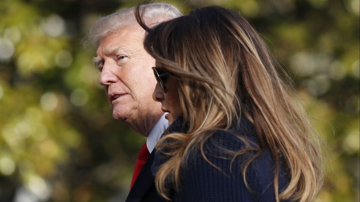 President Trump and First Lady Melania Trump appear at the White House on Monday.