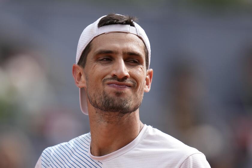 Pedro Cachin of Argentina reacts against Rafael Nadal of Spain during the Mutua Madrid Open tennis tournament in Madrid, Spain, Monday, April 29, 2024. (AP Photo/Manu Fernandez)
