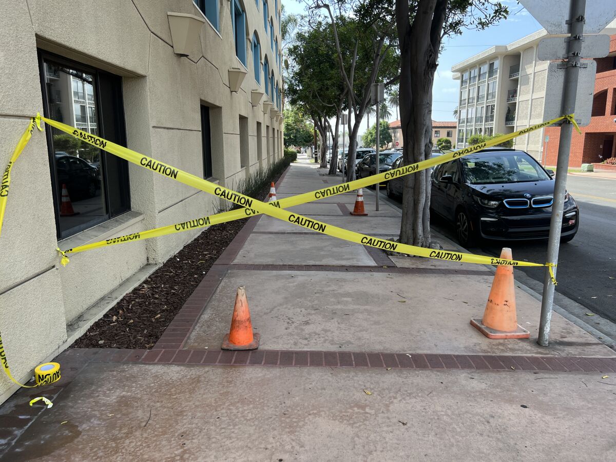 Enhance La Jolla Chairman Ed Witt set up caution tape and cones near where a trip-and-fall incident took place in 2020.