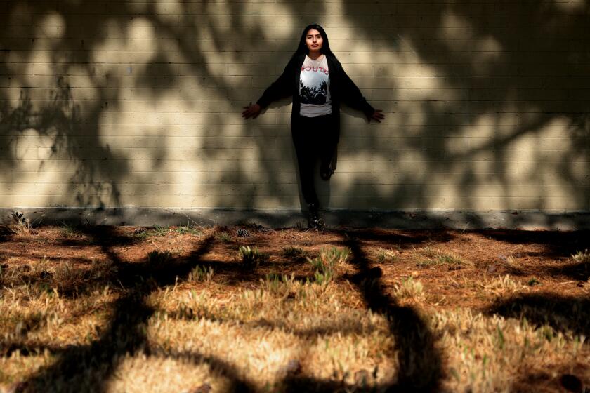 LOS ANGELES, CALIFORNIA-Former foster child Iziko as she poses at a park in Los Angeles. L.A. County is failing to provide placements for older foster youth who decide to stay in county custody until they are twenty one. (Wally Skalij/Los Angeles Times)