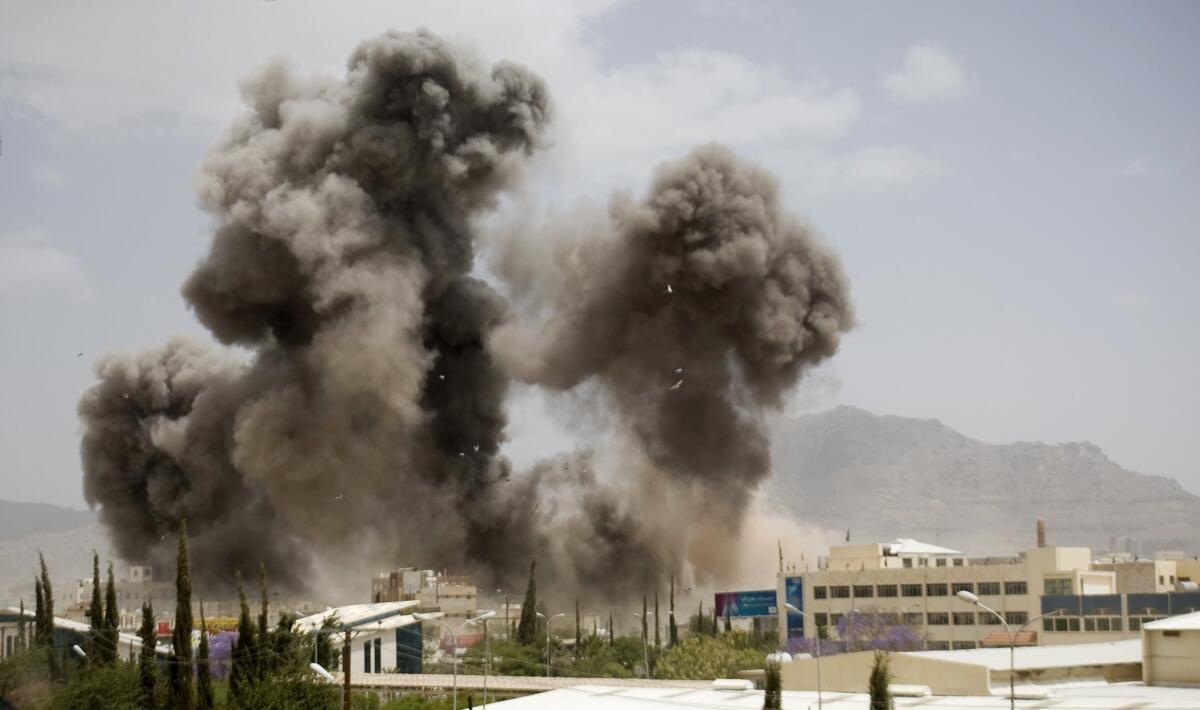 Smoke billows from a Saudi-led airstrike April 8 on Sana, Yemen.