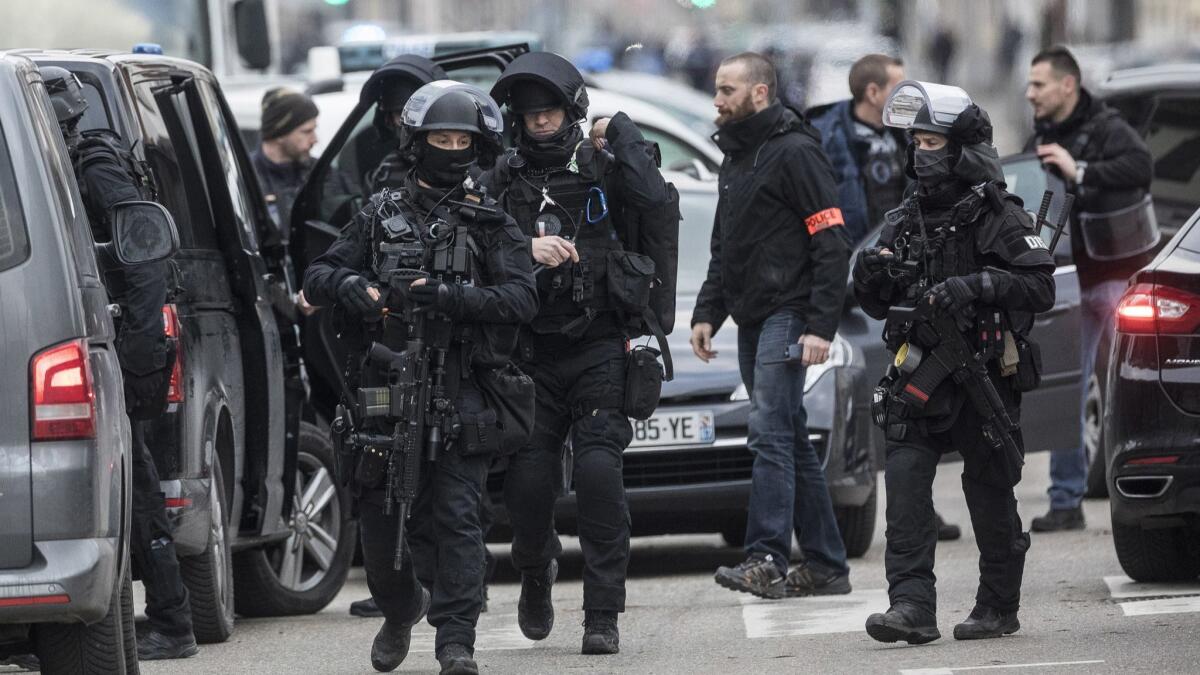 French police forces take position in the Neudorf district of Strasbourg, France, on Thursday.