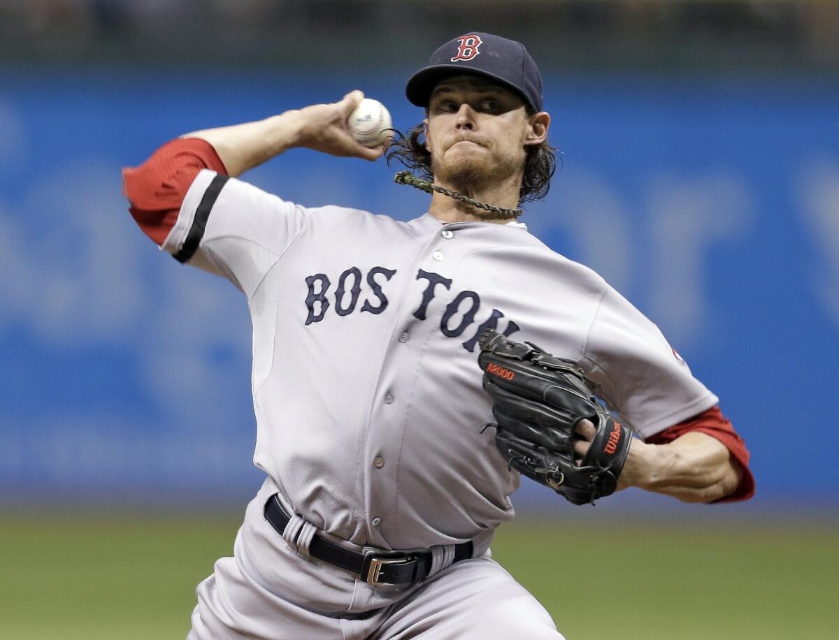 Red Sox starter Clay Buchholz delivers a pitch in Boston's 2-0 victory over the Tampa Bay Rays on Tuesday.