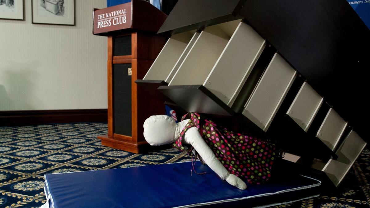 A demonstration shows how an Ikea dresser can tip and fall on a child during a Consumer Product Safety Commission news conference in June 2016. Ikea recalled 30 million chests and dressers.