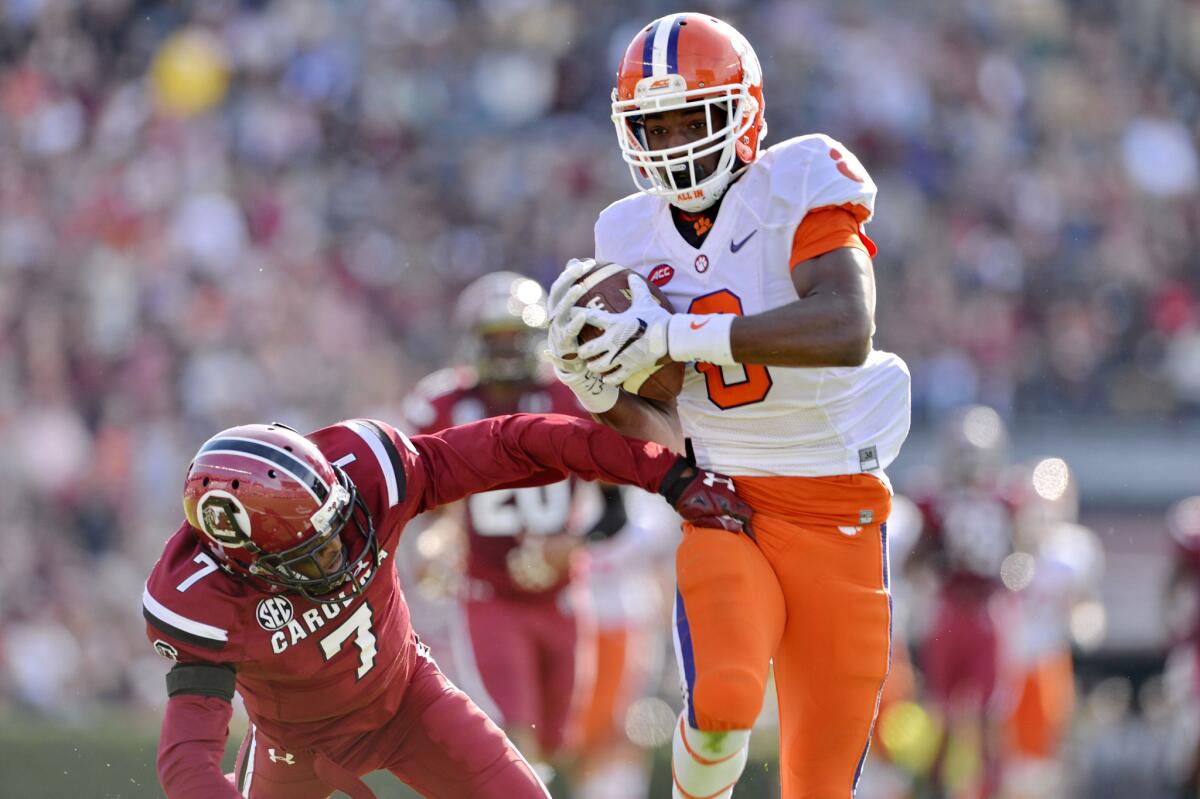 Clemson's Deon Cain pulls in a 55-yard pass for a touchdown while defended by South Carolina's Al Harris Jr. on Nov. 28.