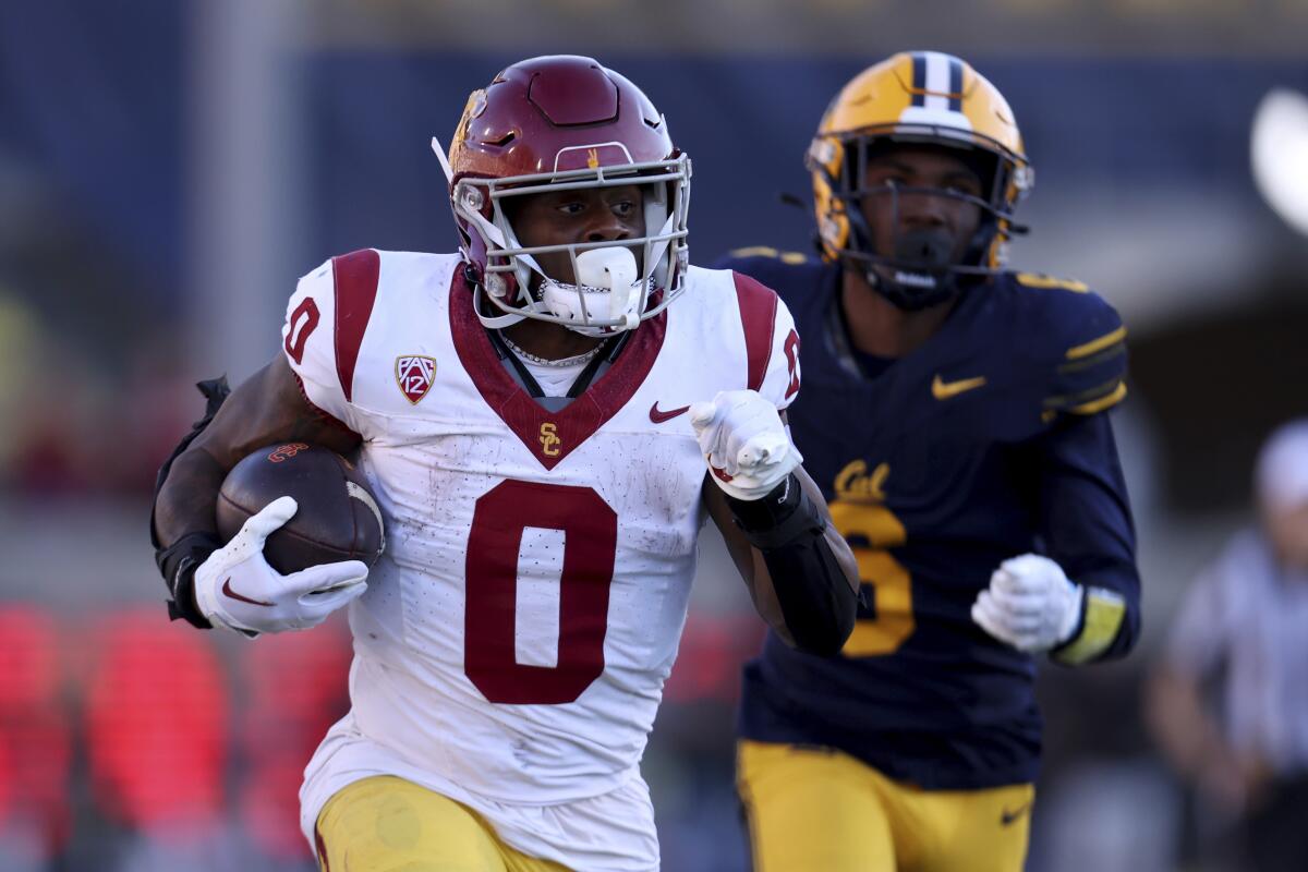 USC running back MarShawn Lloyd carries the ball against Cal in the second half.
