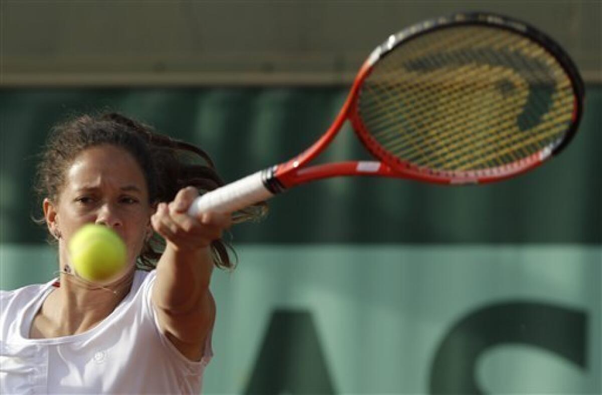 Switzerland's Patty Schnyder returns the ball to Romania's Sorana Cirstea during his first round match of the French Open tennis tournament, at the Roland Garros stadium in Paris, Tuesday, May 24, 2011. (AP Photo/Christophe Ena)
