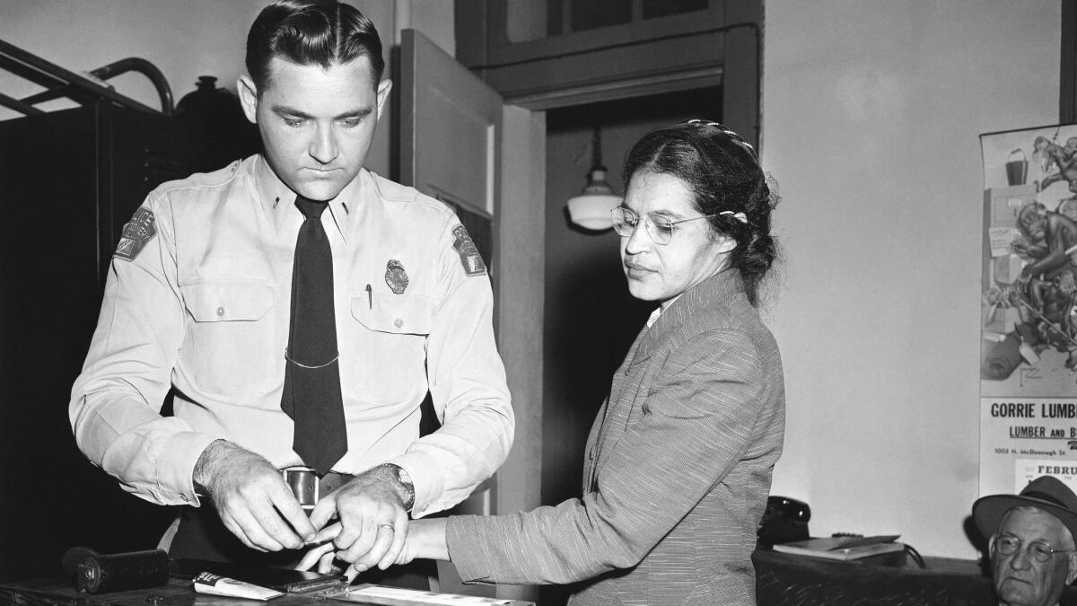 The arrest of Rosa Parks, whose refusal to move to the back of a bus touched off the Montgomery, Ala., bus boycott.