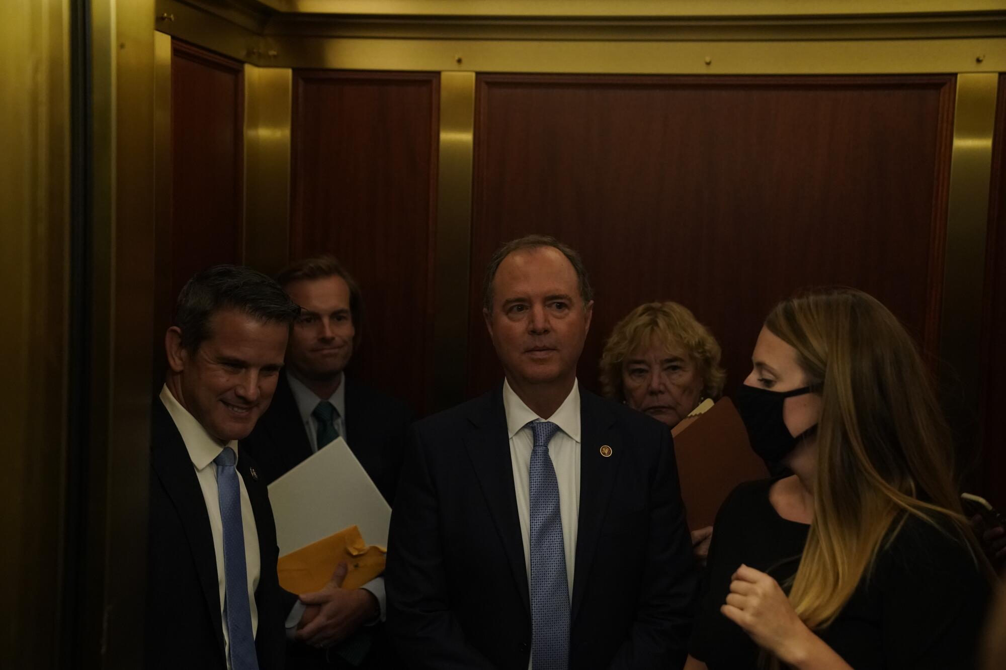 Reps. Adam Kinzinger, Adam B. Schiff and Zoe Lofgren depart.