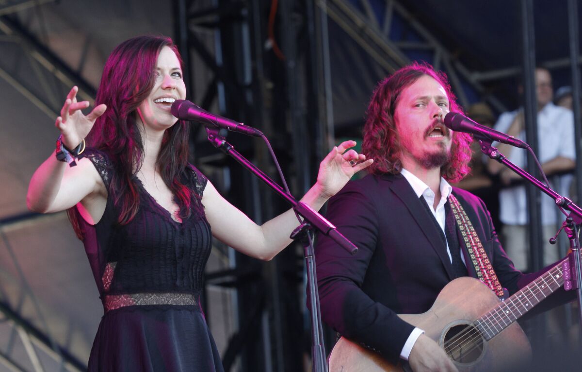 Joy Williams, left, and John Paul White of the Civil Wars perform last month at the Austin City Limits Music Festival in Austin, Texas. They are calling off their upcoming tour dates, citing irreconcilable differences.