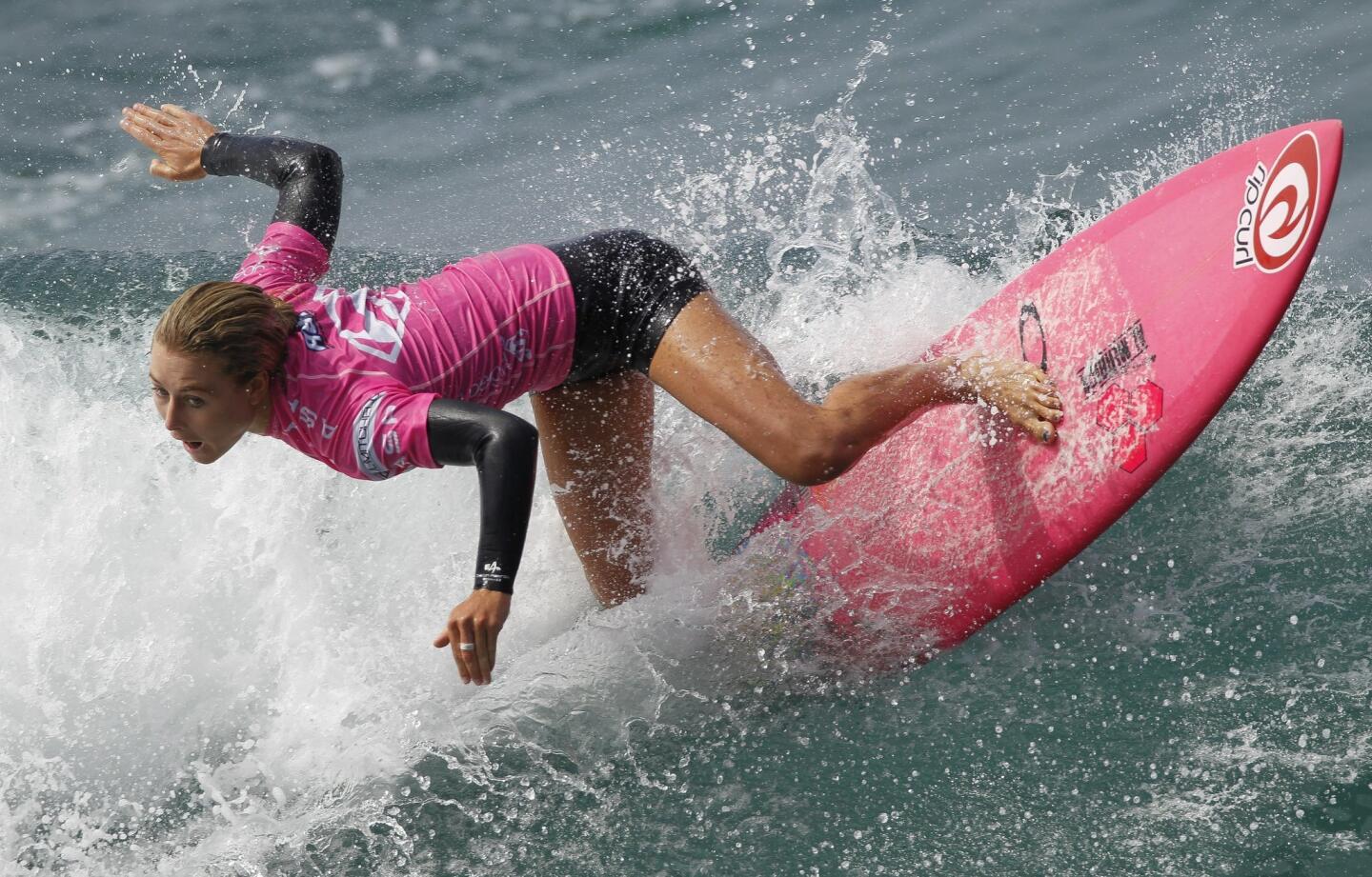 Nikki Van Dijk of Australia competes in Heat 2 of Round 4 of the Paul Mitchell Supergirl Pro surf contest at the Oceanside Pier on Saturday, August 9, 2014.