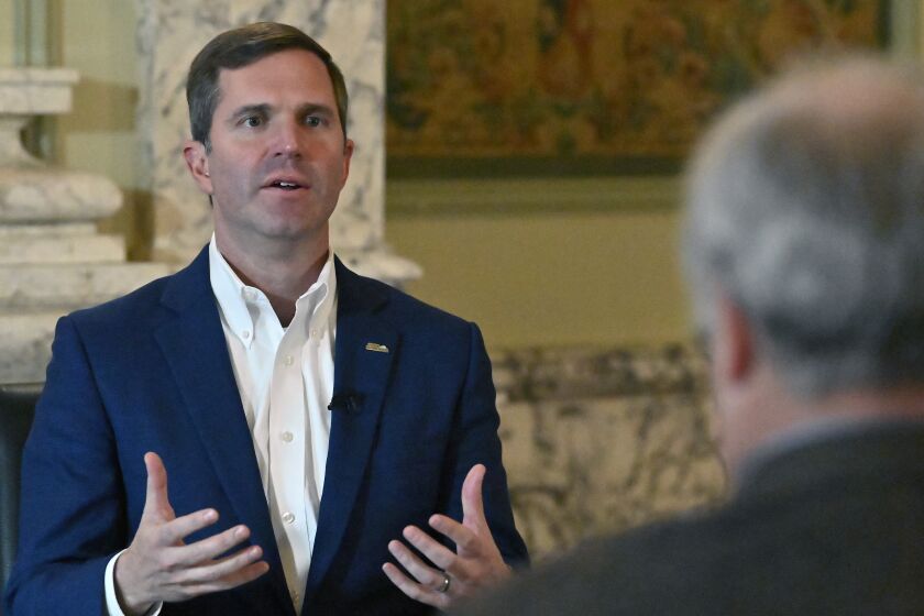 Kentucky Governor Andy Beshear answers questions during an interview with The Associated Press at the Kentucky State Capitol in Frankfort, Ky., Wednesday, Dec. 7, 2022. (AP Photo/Timothy D. Easley)