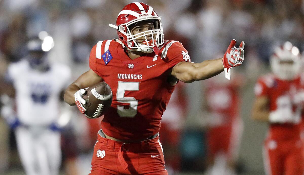 Mater Dei receiver Bru McCoy signals a first down after making a catch against IMG Adademy earlier this season.