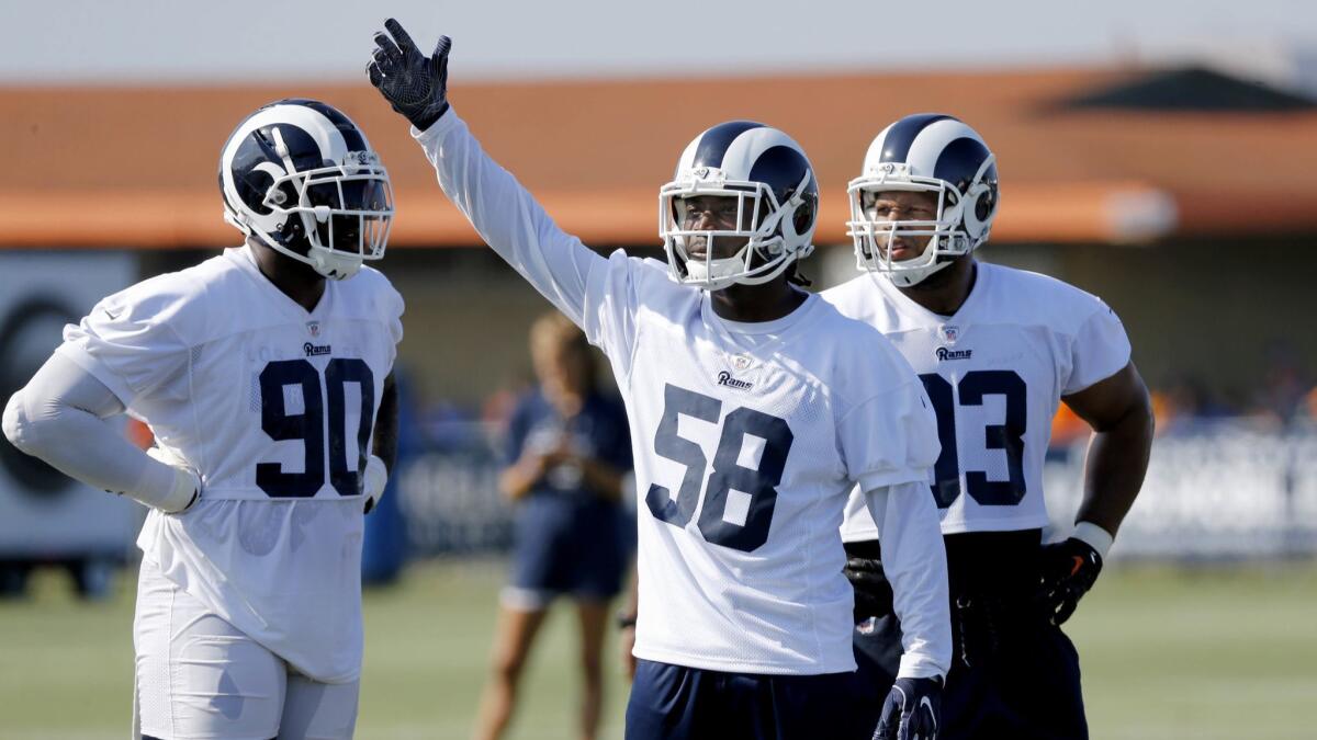 Rams linebacker Cory Littleton, flanked by defensive linemen Michael Brockers (90) and Ndamukong Suh at practice, says he is aware of outside skepticism about the team's linebackers. “We can’t expect people to expect much out of us, but we plan on proving them wrong,” he says.