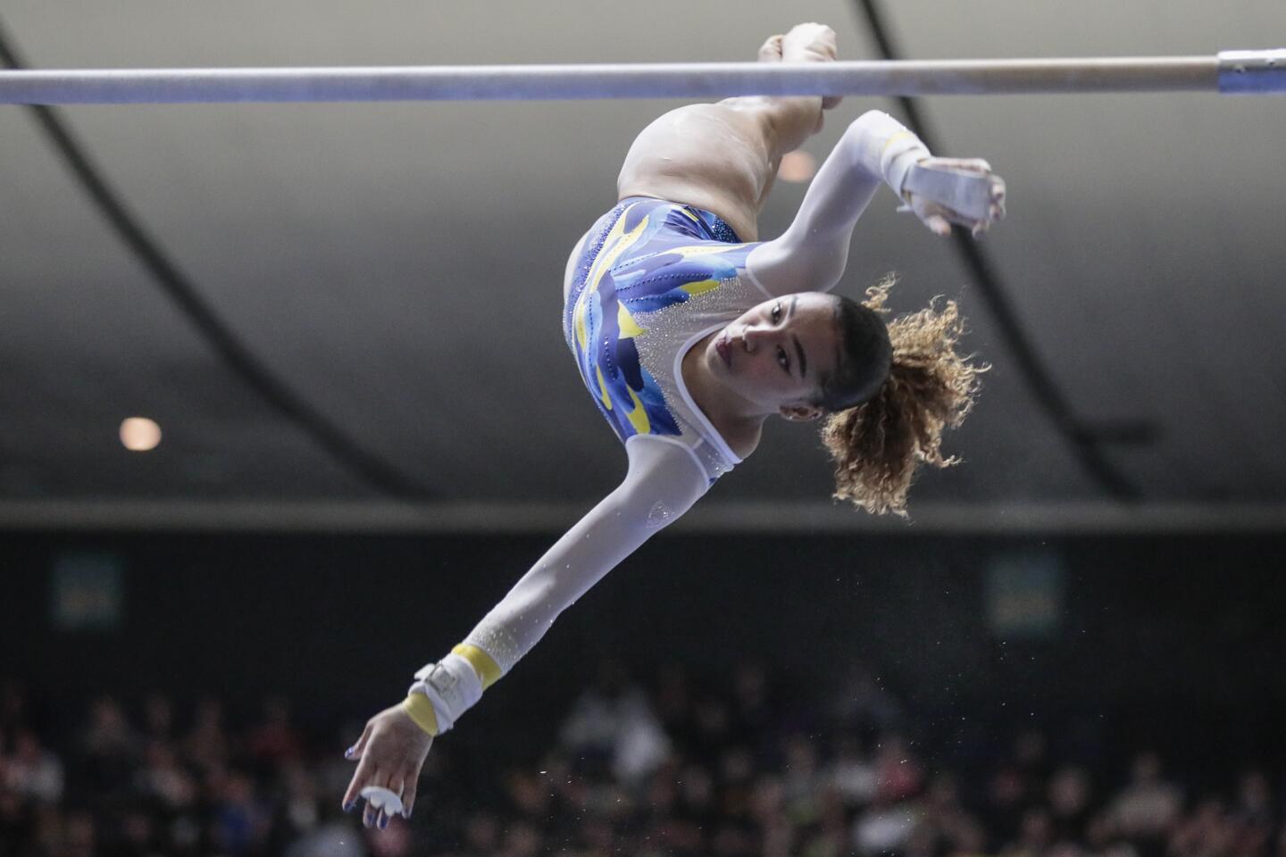 The Bruins' Margzetta Frazier competes on the bars at the Collegiate Challenge gymnastics meet Saturday night.