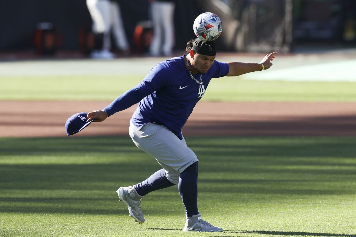 Dodgers reliever Brusdar Graterol heads a soccer ball in the outfield before Game 5 on Thursday.