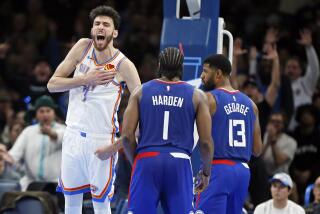 Oklahoma City Thunder forward Chet Holmgren (7) celebrates near Los Angeles Clippers guard James Harden (1) and forward Paul George (13) after Holmgren bounced the ball to himself off the backboard and then dunked during the second half of an NBA basketball game Thursday, Dec. 21, 2023, in Oklahoma City. (AP Photo/Nate Billings)