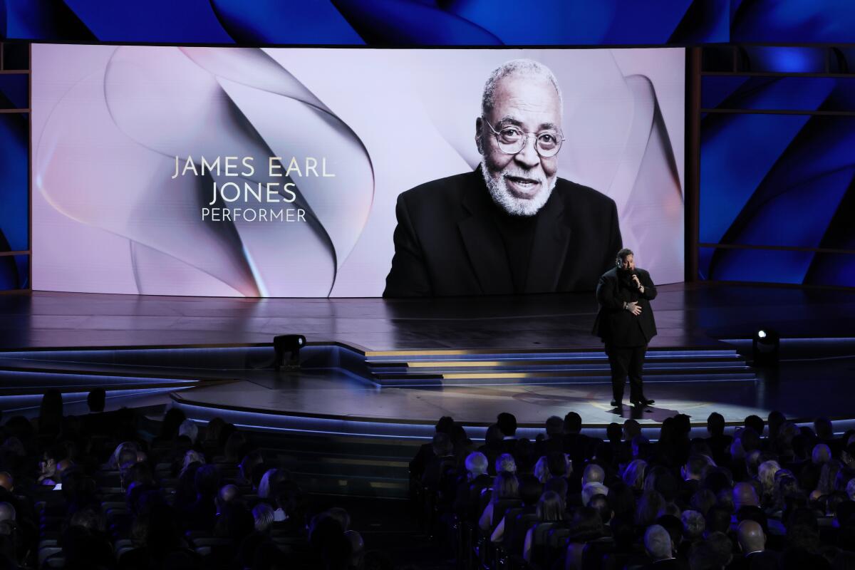 Jelly Roll sings during the Emmys' "In Memoriam" tribute as the screen shows image of James Earl Jones.