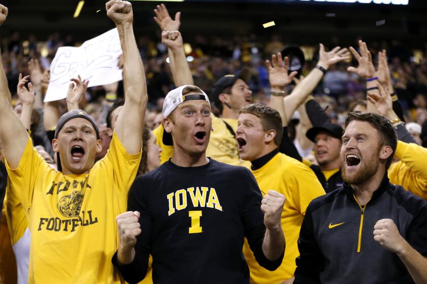 Iowa fans cheer after quarterback C.J. Beathard threw an 85-yard touchdown to Tevaun Smith during the Big Ten Conference championship game on Dec. 5.