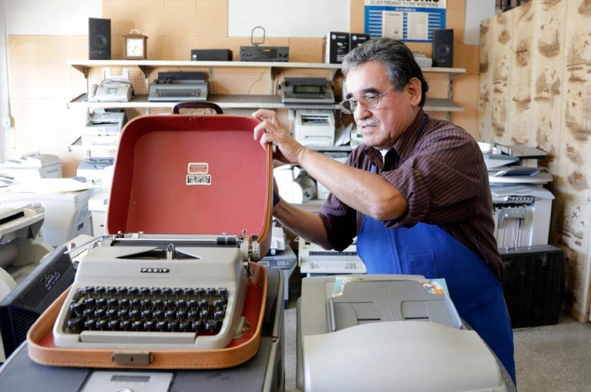 Martin Quezada repairs typewriters at his International Office Machines shop in San Gabriel. A renewed interest in typewriters, especially among younger people, has slowly brought in a few more machines for repair or refurbishing.
