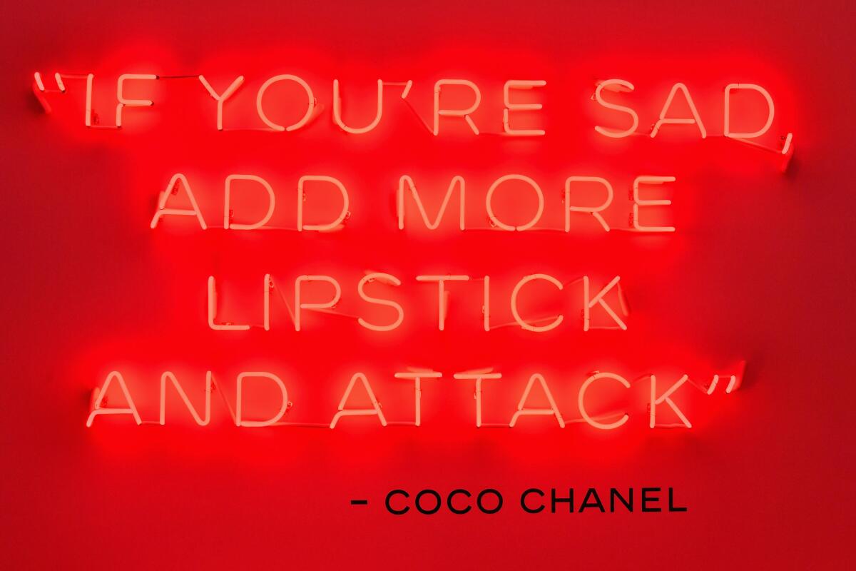 A neon display of a Coco Chanel quote inside the Chanel Beauty House in West Hollywood.