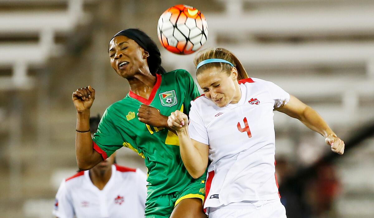 Canada's Shelina Zadorsky, right, battles for the ball with Guyana's Otesha Charles during the 2016 CONCACAF Women's Olympic Qualifying on Thursday.