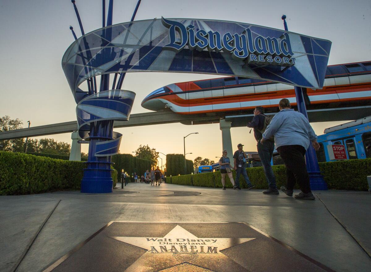 An entrance to Disneyland, with the monorail in the background. 