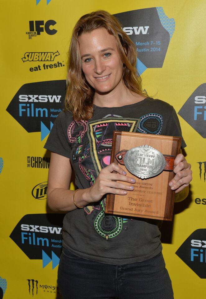 Filmmaker Margaret Brown poses with her Grand Jury Award for documentary feature for the film "The Great Invisible."