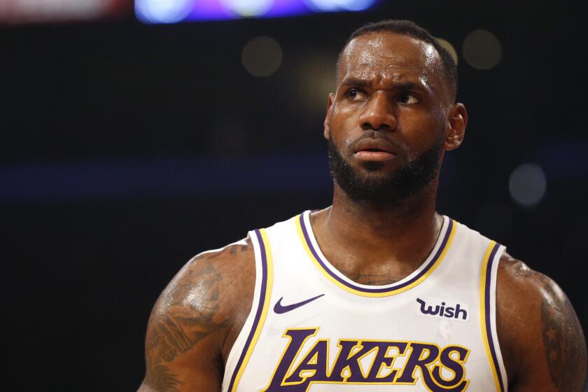 LOS ANGELES, CALIFORNIA - DECEMBER 01: LeBron James #23 of the Los Angeles Lakers looks on during a game against the Dallas Mavericks at Staples Center on December 01, 2019 in Los Angeles, California. NOTE TO USER: User expressly acknowledges and agrees that, by downloading and or using this photograph, User is consenting to the terms and conditions of the Getty Images License Agreement. (Photo by Katharine Lotze/Getty Images)