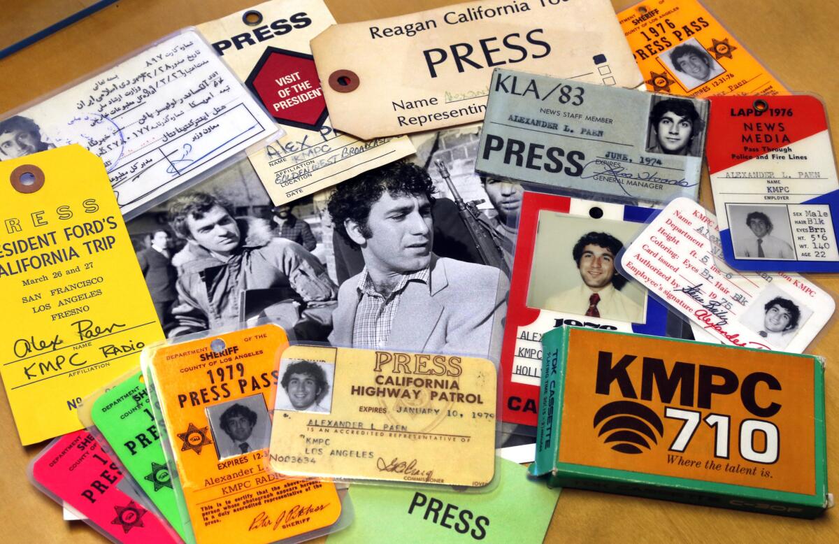 Alex Paen with press passes, photos and memorabilia in his Santa Monica office where he is founder and president of Telco Productions, Inc.