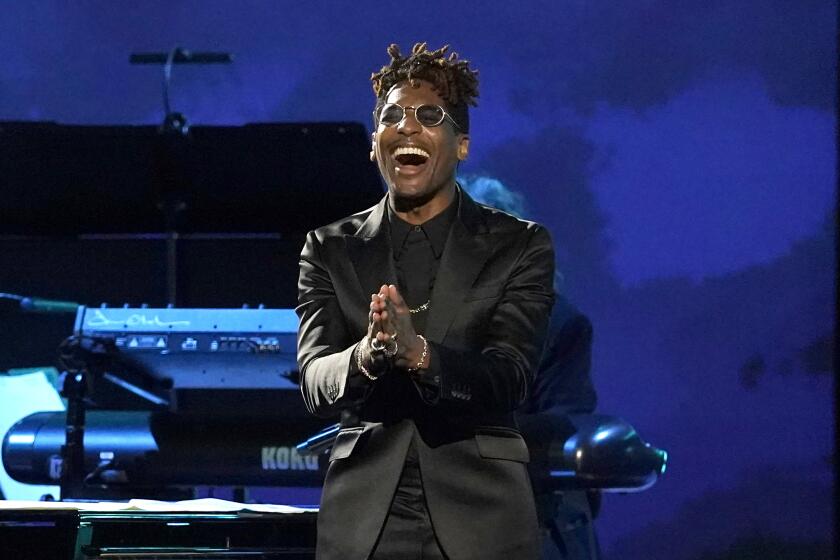 Jon Batiste performs a medley at the 31st annual MusiCares Person of the Year benefit gala honoring Joni Mitchell on Friday, April 1, 2022, at the MGM Grand Conference Center in Las Vegas. (AP Photo/Chris Pizzello)