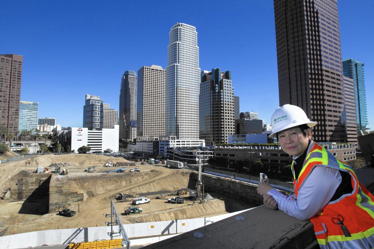 I-Fei Chang, chief executive of Greenland USA, looks over the site of its $1-billion Metropolis Los Angeles hotel, condo and shopping complex last year. The company said she has resigned for “personal reasons.”