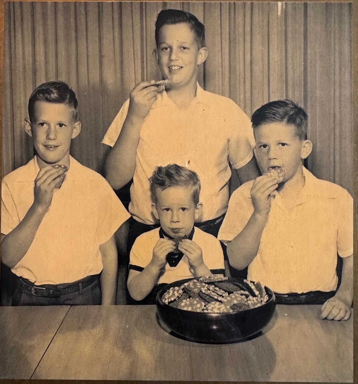 A vintage photo of grandsons of Laura Scudder enjoying cookies made from Laura Scudder peanut butter.