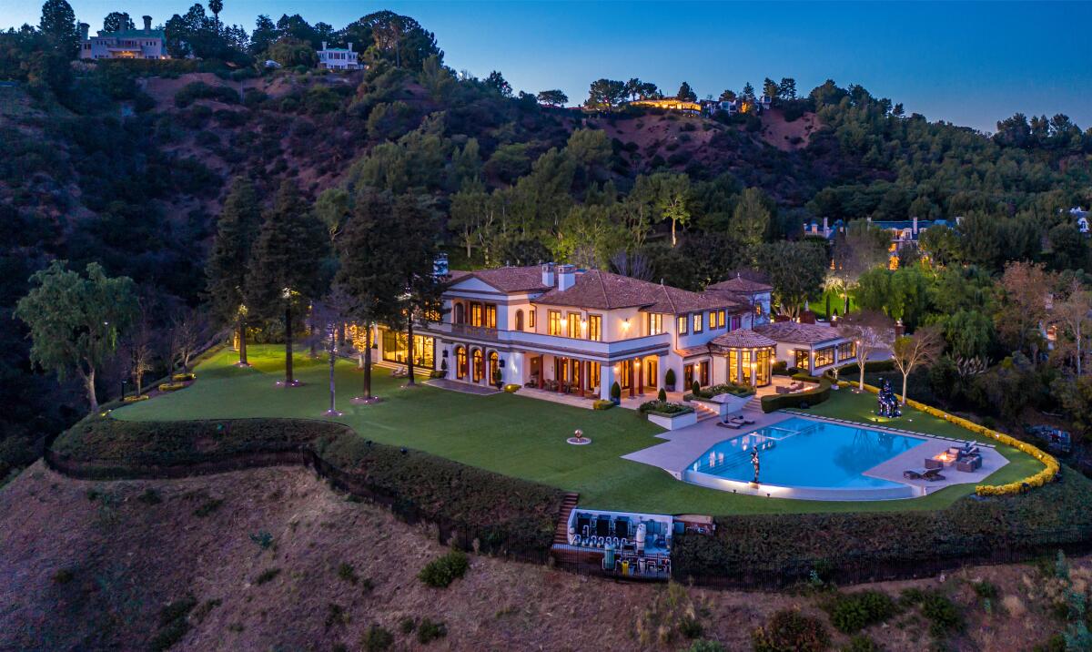 The 21,000-square-foot home sits on 3.5 acres with views of the city below.