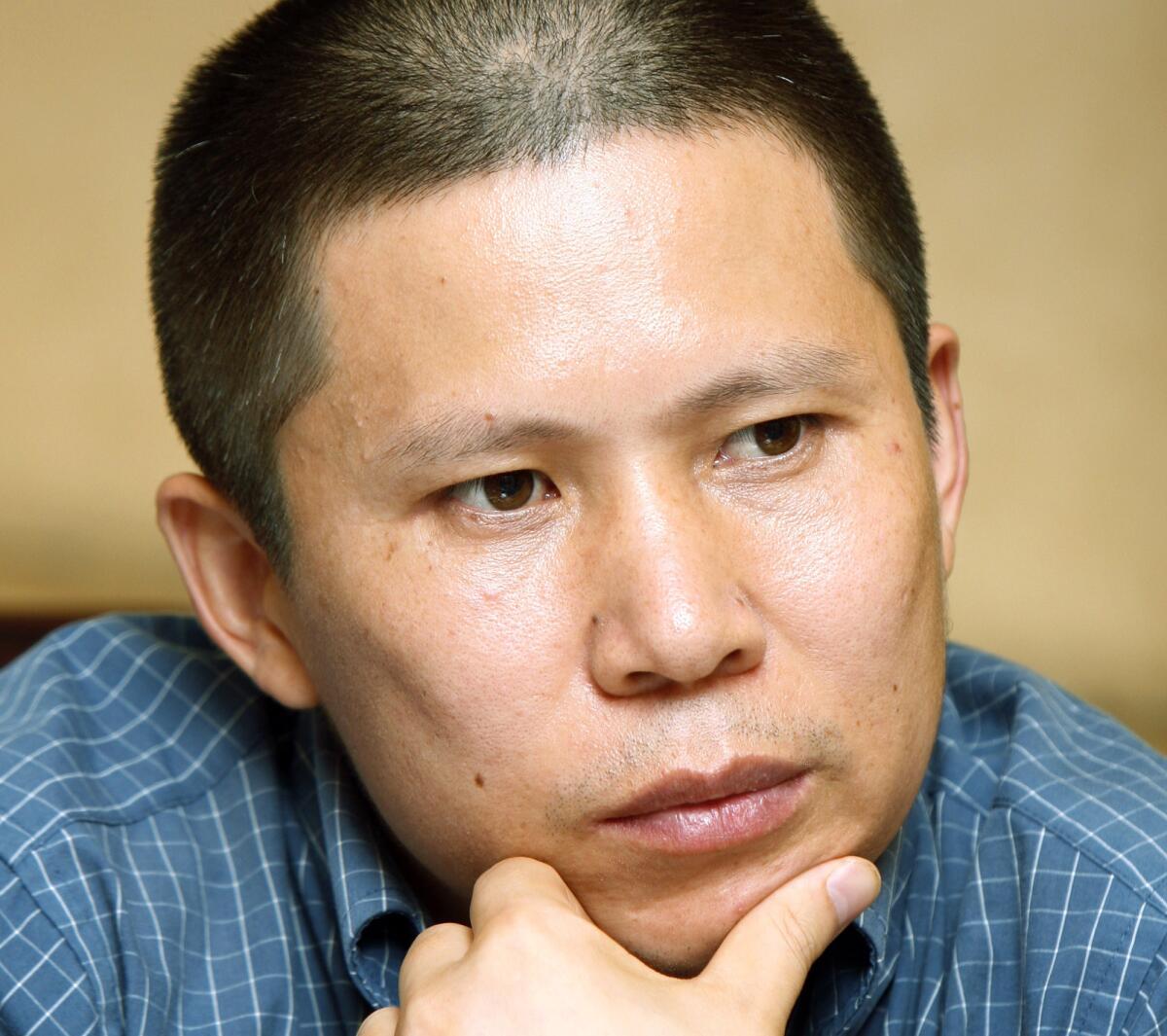 Legal scholar Xu Zhiyong attends a meeting in Beijing on July 17, 2009.