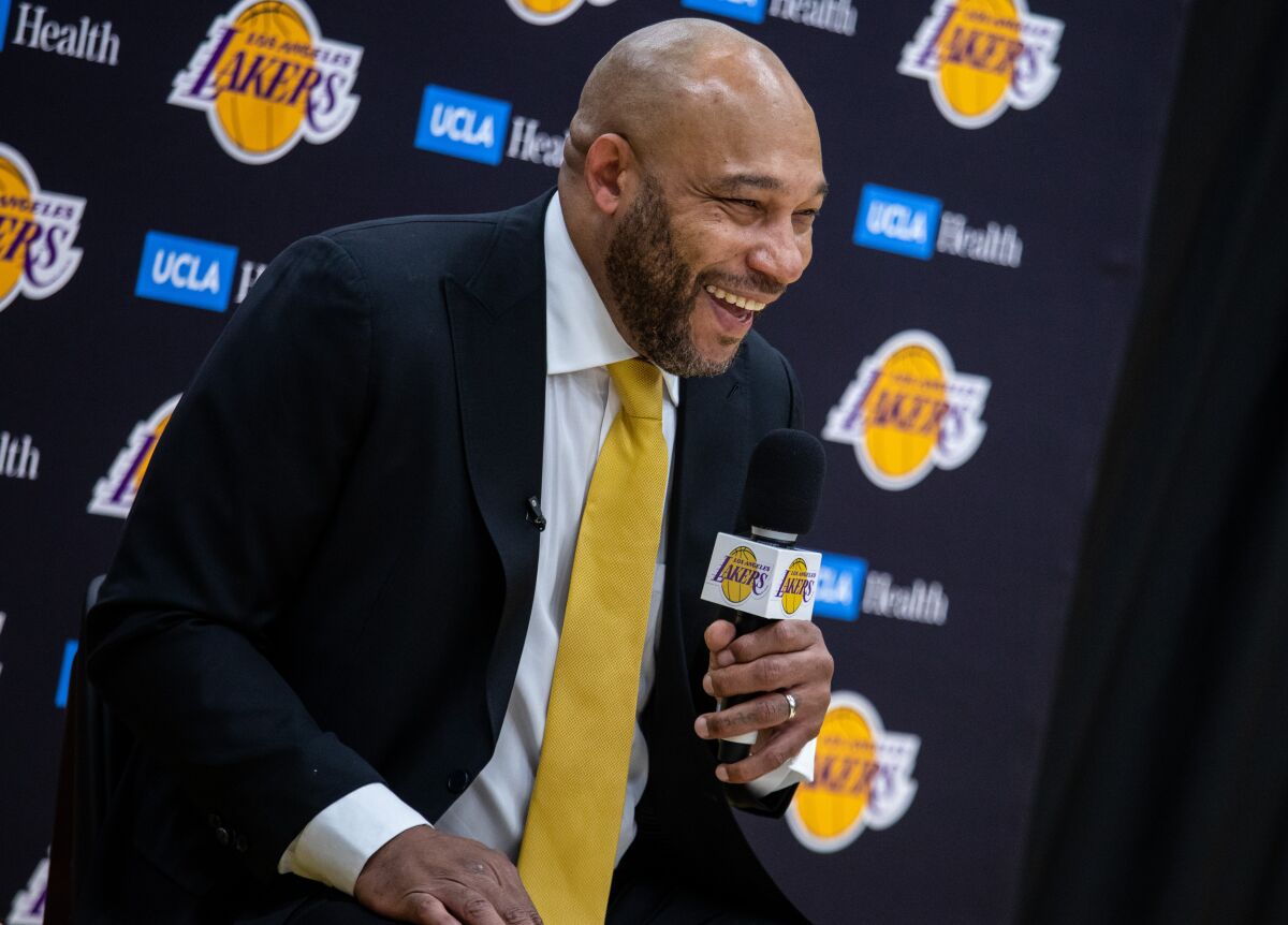 New Lakers coach Darvin Ham has a wide grin as he speaks to the media Monday.